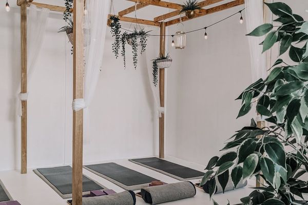 Serene yoga studio atmosphere with soft lighting and mats
